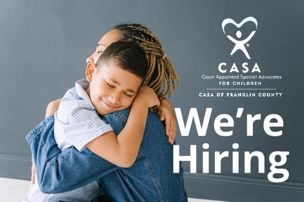 An image of a young boy hugging an adult volunteer with text that says 'CASA Court Appointed Special Advocates FOR CHILDREN CASA OF FRANKLIN COUNTY We're Hiring.'