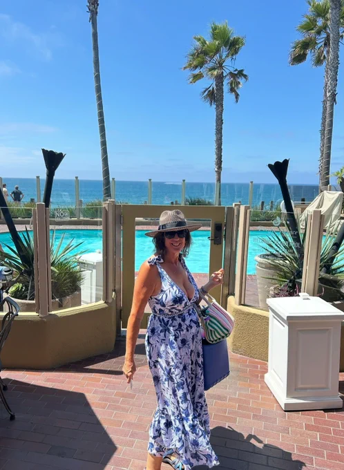 Woman standing in front of pool