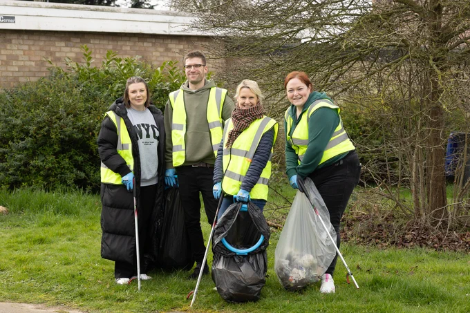4 SettleParadigm colleagues with litter picking tools