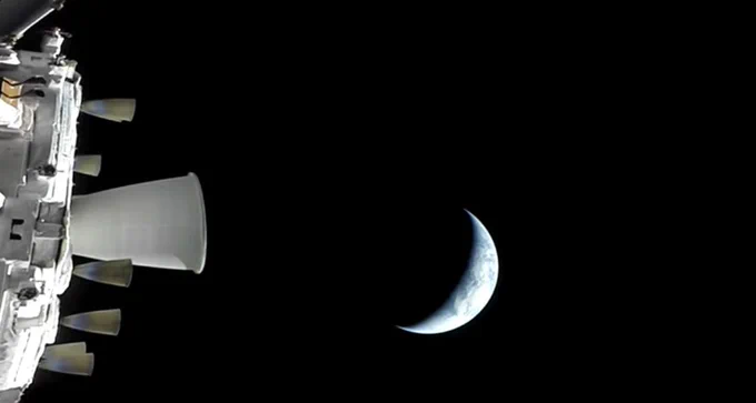 Artemis II mission's Orion spacecraft about to leave Earth's orbit (Earth visible in the background) on it's way to trans lunar injection orbit. Image: screenshot from NASA's live broadcast.