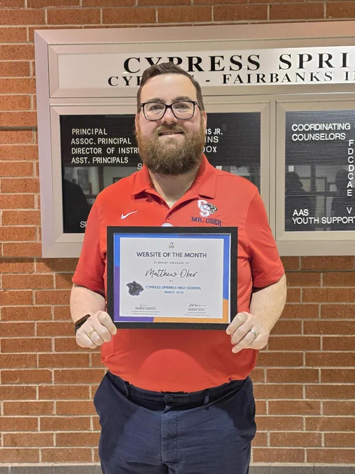 Matthew Ober with his website of the month certificate