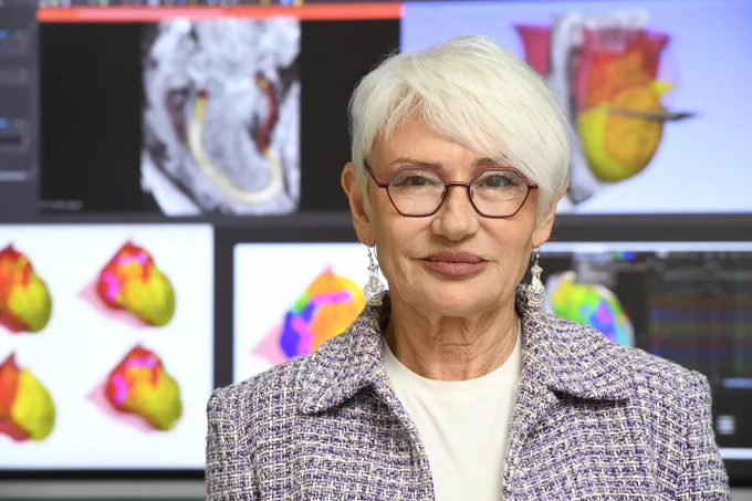 Natalia Trayanova in front of screens with a variety of digital twin heart visualizations. 