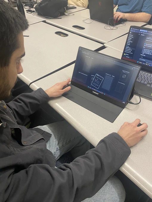 A person is playing a game on a laptop computer.
