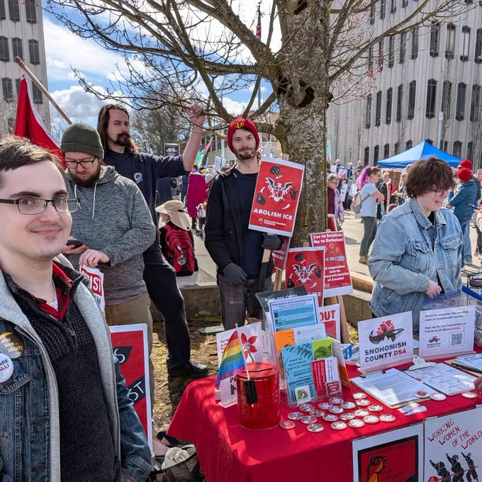 This is a photo of several SnoCo DSA members at the March 28th No Kings Rally in Everett WA. They are holding signs that say resist fascism and abolish ice.