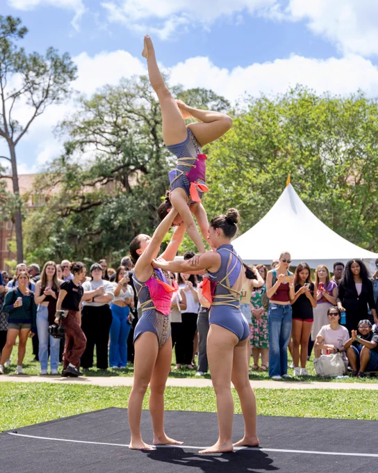 The FSU Flying High Circus performs while a crowd watches.