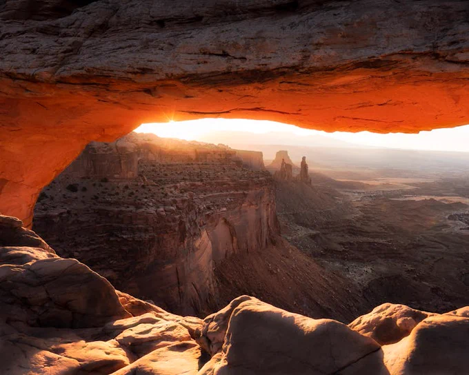 Stunning sunrise view through Mesa Arch in Canyonlands National Park, Utah.