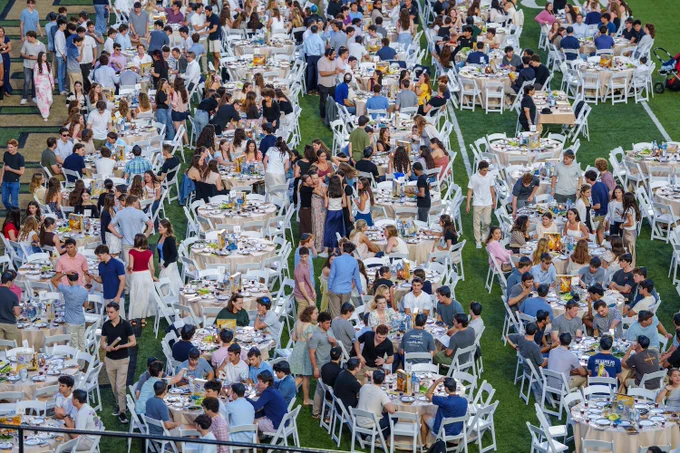 An aerial shot shows students gather on the field of FirstBank Stadium for Chabad of Vanderbilt's annual Passover celebration.