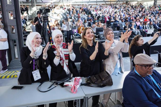 A group of participants clap and smile during the closing ceremony of GDS 2025. 