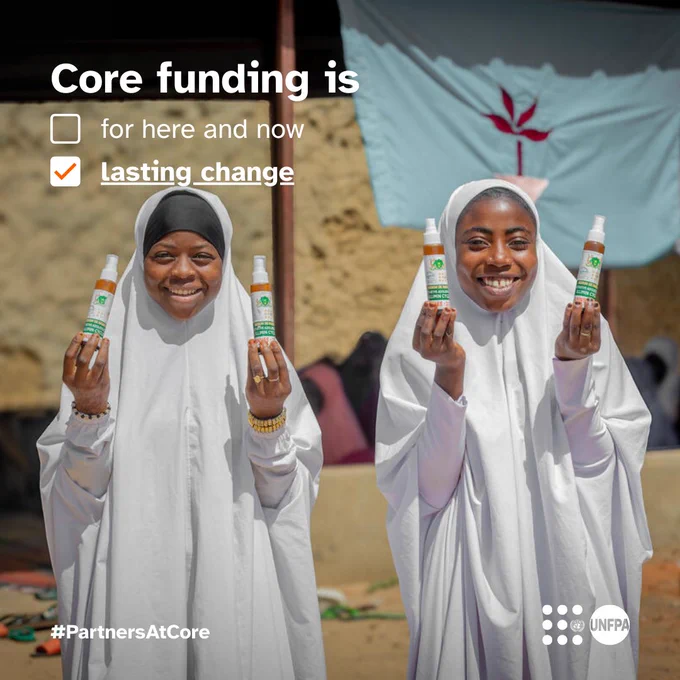 A photo of two girls dressed in white smiling broadly and holding up liquid dispensers of some kind for the camera. White text overlaid on the photo reads “Core funding is”. Below are two tickboxes each with an option to complete the sentence. One, unticked, reads “for here and now”. The other, ticked, reads “lasting change”. At the bottom is the #PartnersAtCore hashtag and the UNFPA logo.