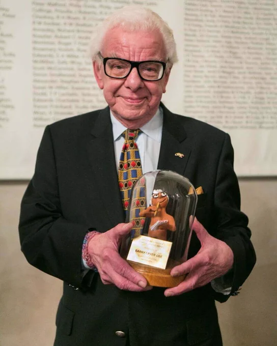 Barry Cryer holding his Comedy Legend Award 
