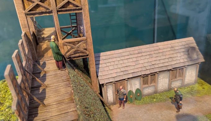 Model Roman soldiers on a cross section of the Antonine Wall. The picture also shows a model watch tower and bothy.