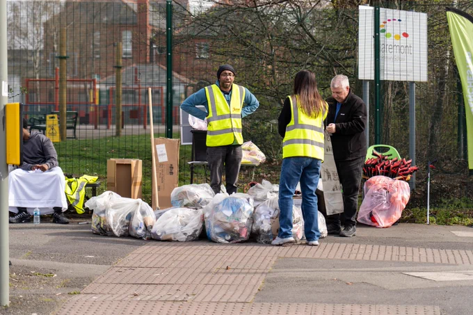 An image showing volunteers taking part in litter picking as part of the Great British Spring Clean campaign in South Manchester.