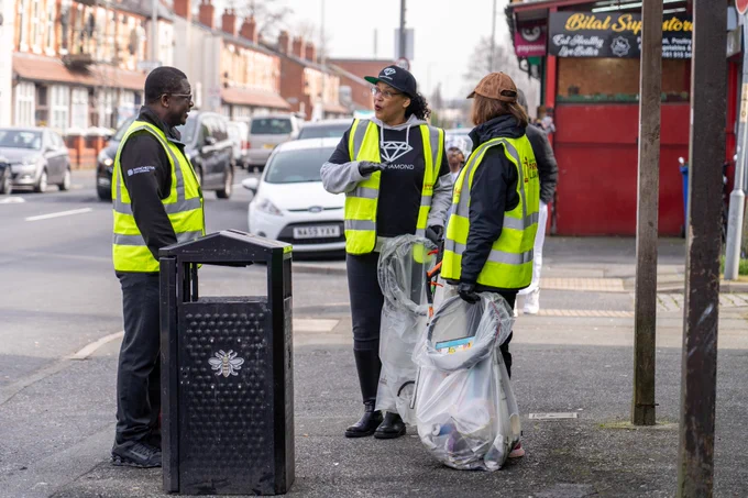 An image showing volunteers taking part in litter picking as part of the Great British Spring Clean campaign in South Manchester.