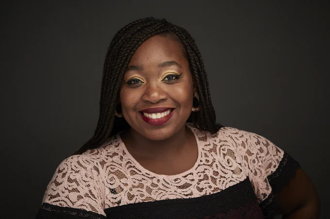 A headshot of Dr. Ashley Graham-Perel, EdD, MS, RN, CNE, who is an Assistant Professor, Director of the Office of Engagement and Community Affairs, and historian at Columbia University School of Nursing.