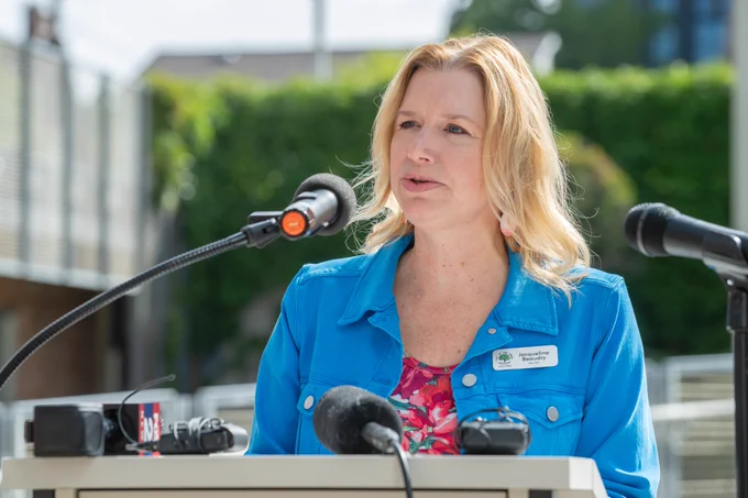 Ann Arbor City Clerk Jackie Beaudry at the podium in September 2025 during a city event at Larcom City Hall