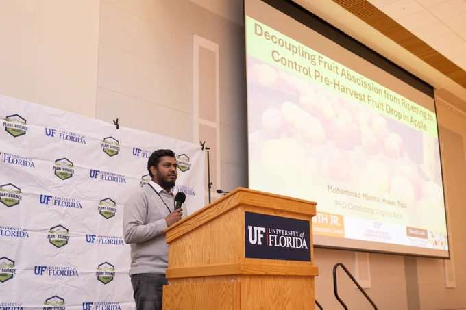 Ph.D. candidate Mohammad Monirul Hasan Tipu speaking at the University of Florida Plant Science Symposium.