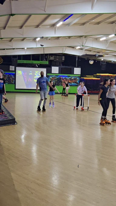 Dr. Mizell skates with students.