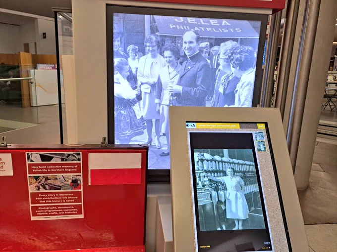 Exhibition screens with historic photographs of people from Polish community 