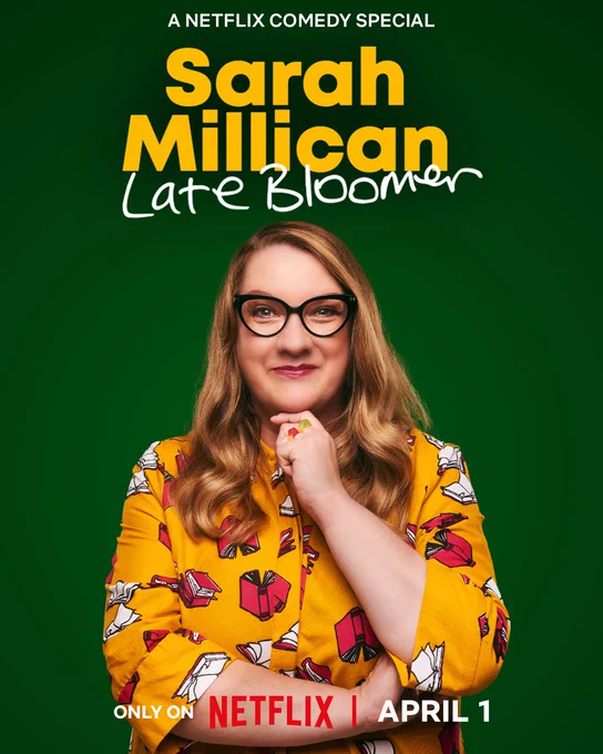 It’s my Late Bloomer poster. Lush green background. I’m in a yellow Zuri dress with pink books flying about on it. My hair is long and wavy and I have my hand under my chin and my other hand is tucked in the crook of my arm.
The text says:
A Netflix Comedy Special
Sarah Millican
Late Bloomer
Only on Netflix April 1.