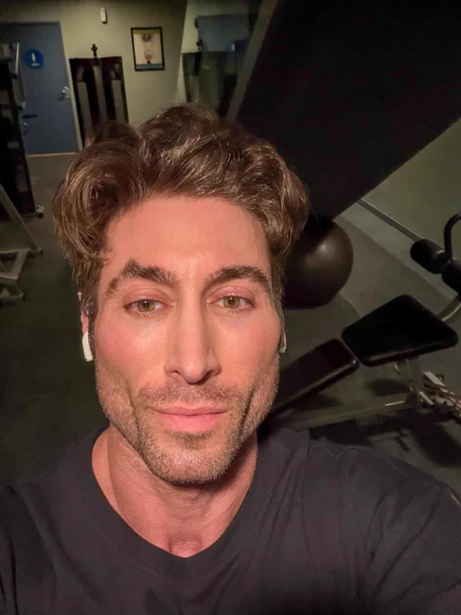 A professional bodybuilder and fitness model about to go through a back workout in the gym.