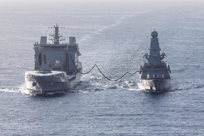 HMS Dragon takes on supplies during her voyage to Cyprus