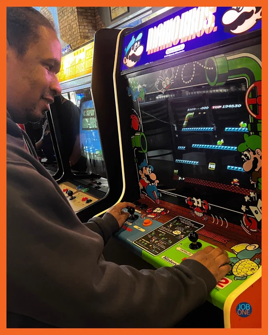 Pooh is playing an arcade game