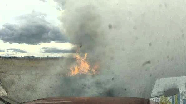 Smoke and flames in a dry field