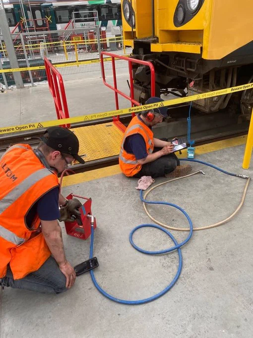 Picture showing two members of Team 507 working on the air systems