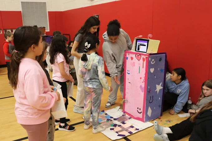 5th graders explaining their arcade game to younger kids