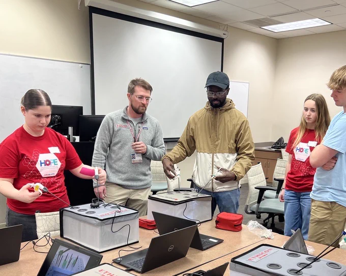 Volunteers teach laparoscopic skills to students