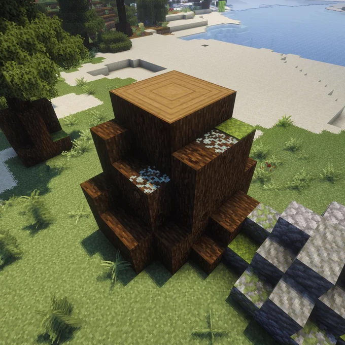 A Minecraft scene of a large tree stump with connected rings