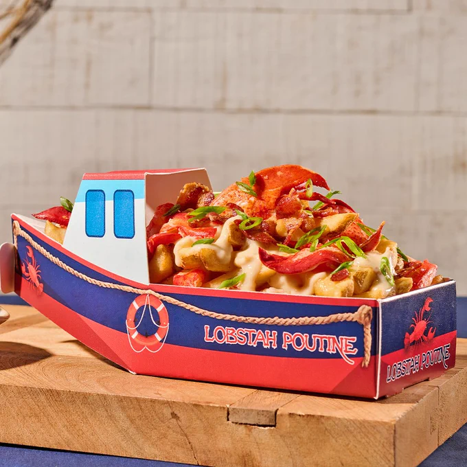 The new "Lobstah Poutine" being served at Fenway Park. The dish features crispy fries, lobster meat, clam chowder and crispy bacon all served in a custom lobster boat.