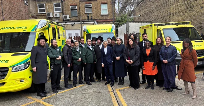 Mayor Sadiq Khan stands in front over three ambulances, alongside Deputy Mayors Kaya Comer-Schwartz, Debbie Weekes-Bernard and Mete Coban, Council leaders Cllr Peray Ahmet and Cllr Caroline Woodley, and a number of representatives from Hatzola Ambulance Service