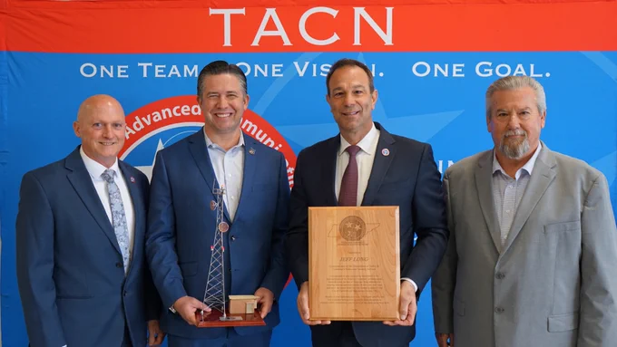 TACN Director Jeff Gray, Mayor Golden, Chief Dolente and Retired Director Montgomery County EMS Jimmie Edwards with a replica of a radio tower and commemorative plaque.