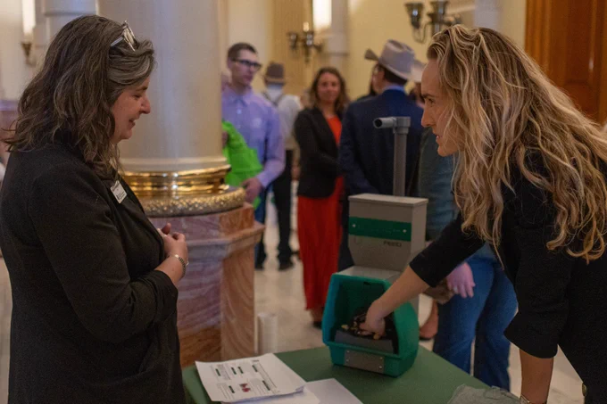 AgNext team speaking with people at Ag Day at the Capitol