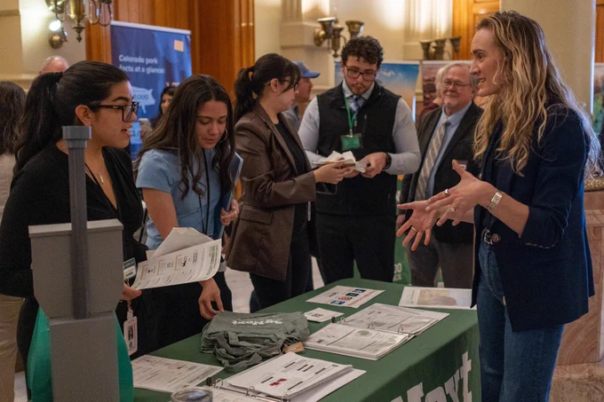 AgNext team speaking with people at Ag Day at the Capitol