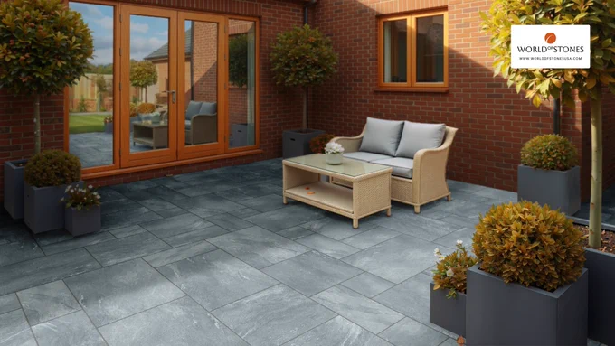Modern residential patio finished with Cerapave Silver Grey outdoor porcelain paving in a modular layout with seating and landscaped planters.