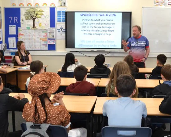 A representative from Cardinal Hume Centre giving a school assembly about youth homelessness