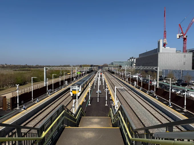 looking from the secondary bridge along the length of the island platform towards the station building. 