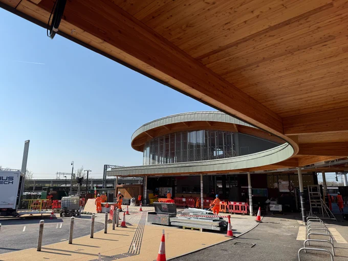 Bicycle racks being installed under the canopy of the eastern station building entrance