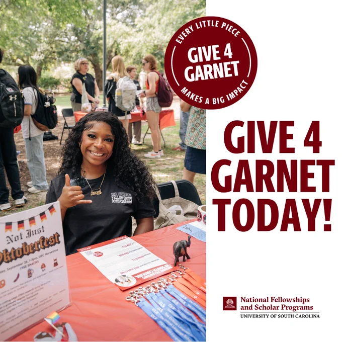 Photo of a Fellowship Ambassador tabling during a National Fellowships event. To the right, the graphic reads: Give 4 Garnet Today! The National Fellowships logo is at the bottom.