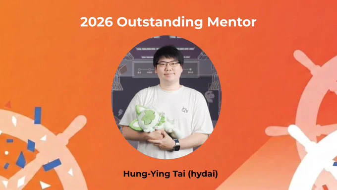 The 2026 Outstanding Mentor award winner holding a stuffed animal and smiling in a slide.