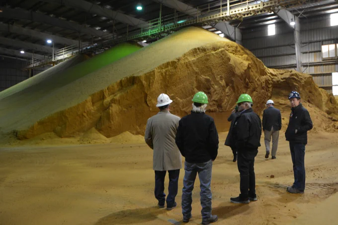 Regional Administrator Jim Macy and EPA staff look at the Lincolnway Energy's DDG storage area.