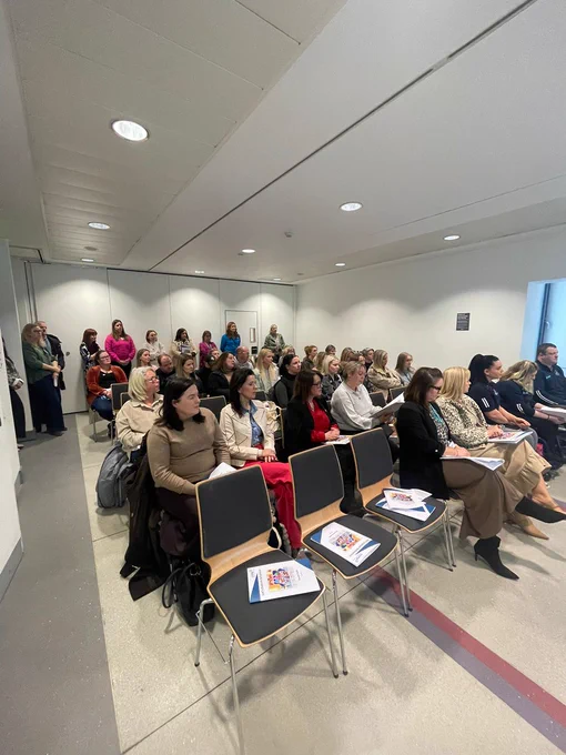A full room of attendees seated at the Lets Explore Behaviour launch