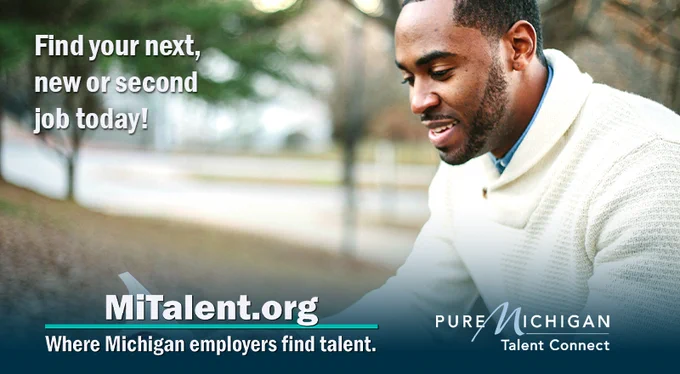 Young Black man browsing on laptop while sitting outside. Text on image says, "Find your next, new or second job today! MiTalent.org, where Michigan employers find talent."