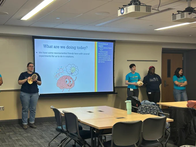 Neuroscience researchers address a classroom 
