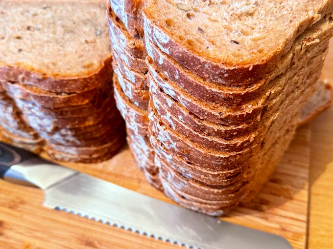 Sliced homemade bread, stacked up ready to freeze