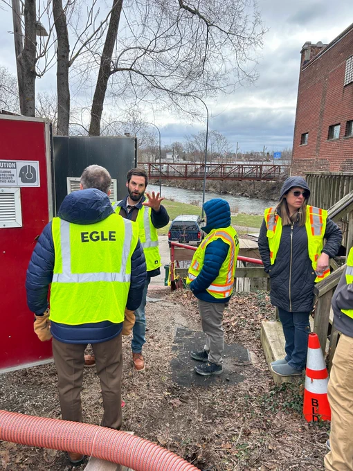 Staff and EGLE Director Phil Roos talk on the ground in Jackson and Ypsilanti.