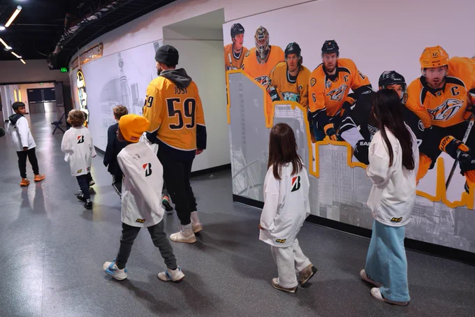 Image of Roman Josi leading a locker room tour during tonights CORE program event 