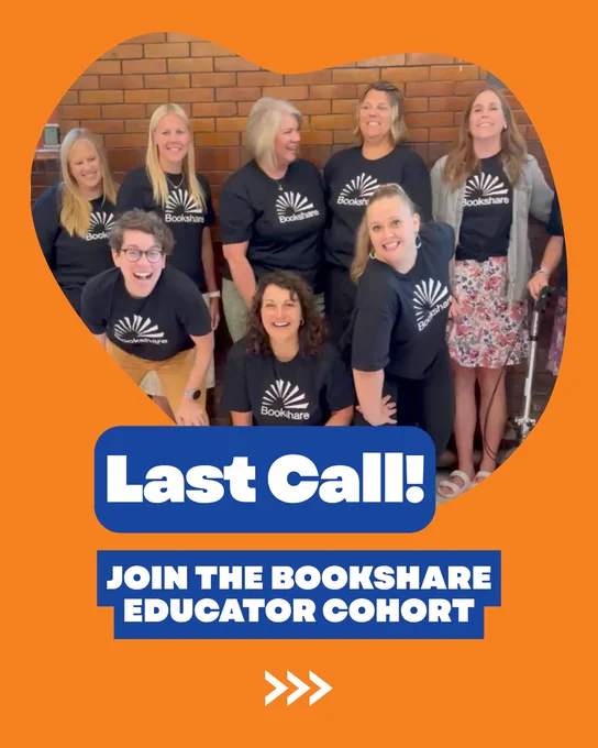A group of educators wearing Bookshare shirts pose in front of a brick wall.